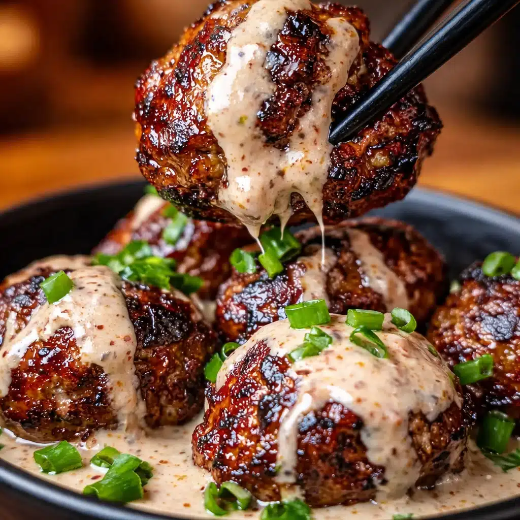 Korean BBQ Meatballs with Spicy Mayo Dip served on a plate with garnish.