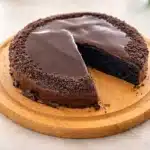 Decadent Oreo Cake with layers of cookies and cream frosting and chopped Oreos