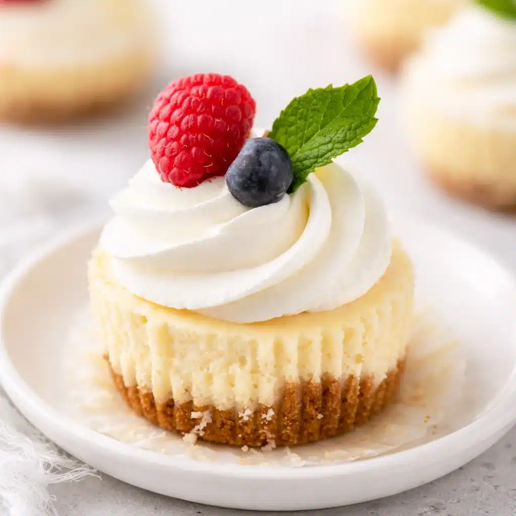 Delicious mini cheesecakes baked in a muffin pan with a graham cracker crust.