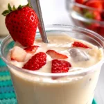 Delicious Fresas con Crema dessert featuring fresh strawberries and creamy sauce.