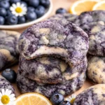 Lemon Blueberry Cheesecake Cookies with a creamy center and lemon glaze on top.