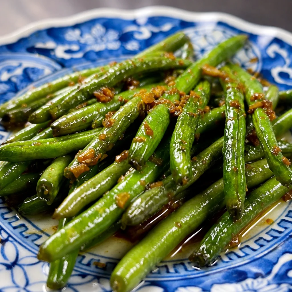 Chinese Green Beans Stir Fry with garlic and ginger in a wok
