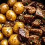 Slow Cooker Garlic Butter Beef Bites with Potatoes in a rich garlic butter sauce