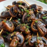 Delicious Balsamic Garlic Grilled Mushroom Skewers on a grill.