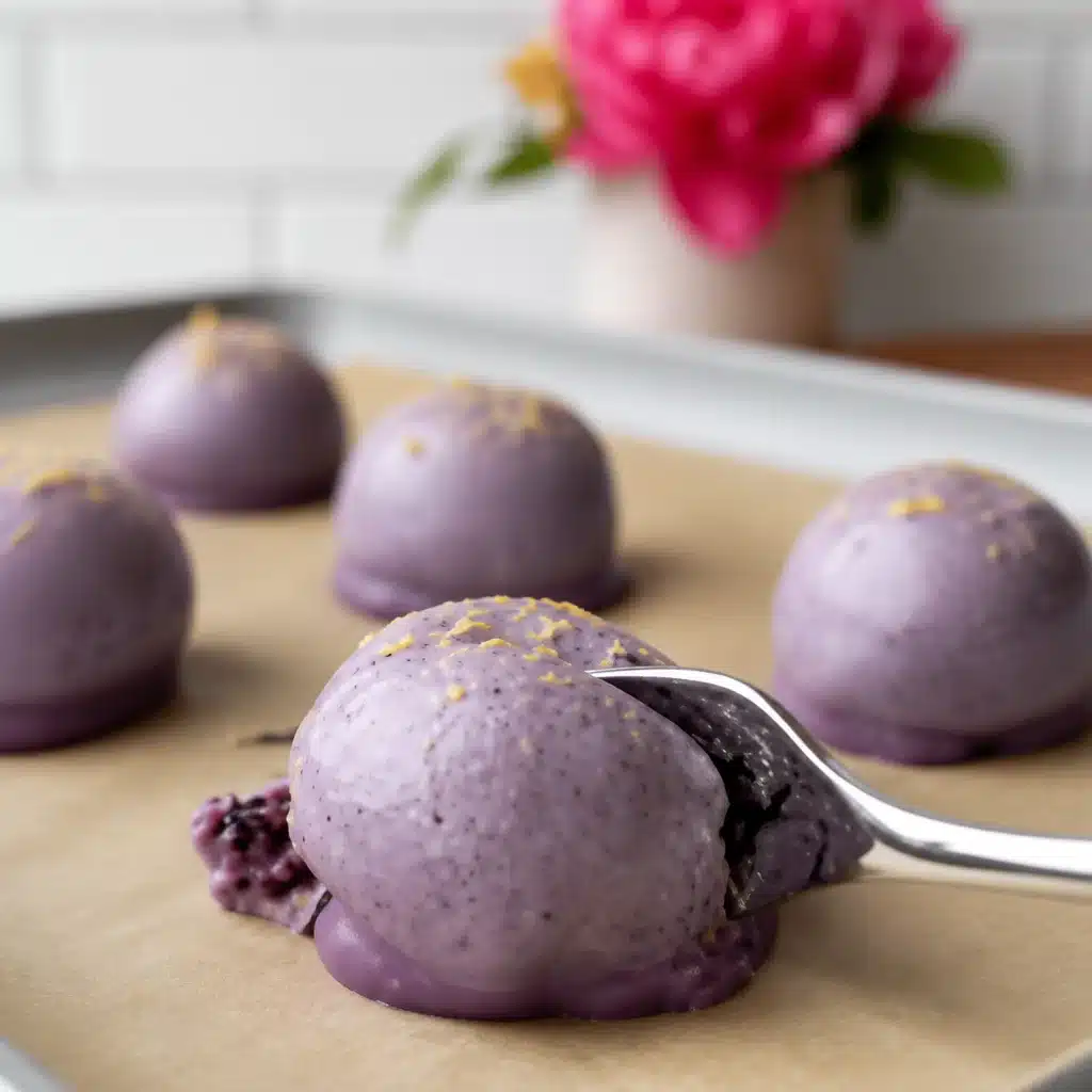 Delicious No-bake lemon blueberry truffles on a white plate with blueberries.