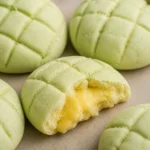 Delicious Japanese Honeydew Bread with honeydew custard filling and crunchy coating.