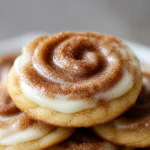 Soft Batch Cinnamon Roll Cheesecake Cookies topped with cream cheese frosting.