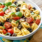 Simple cold tortellini pasta salad featuring cheese tortellini, veggies, and Italian dressing