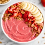 Delicious Strawberry Banana Smoothie Bowl topped with fresh fruits and granola