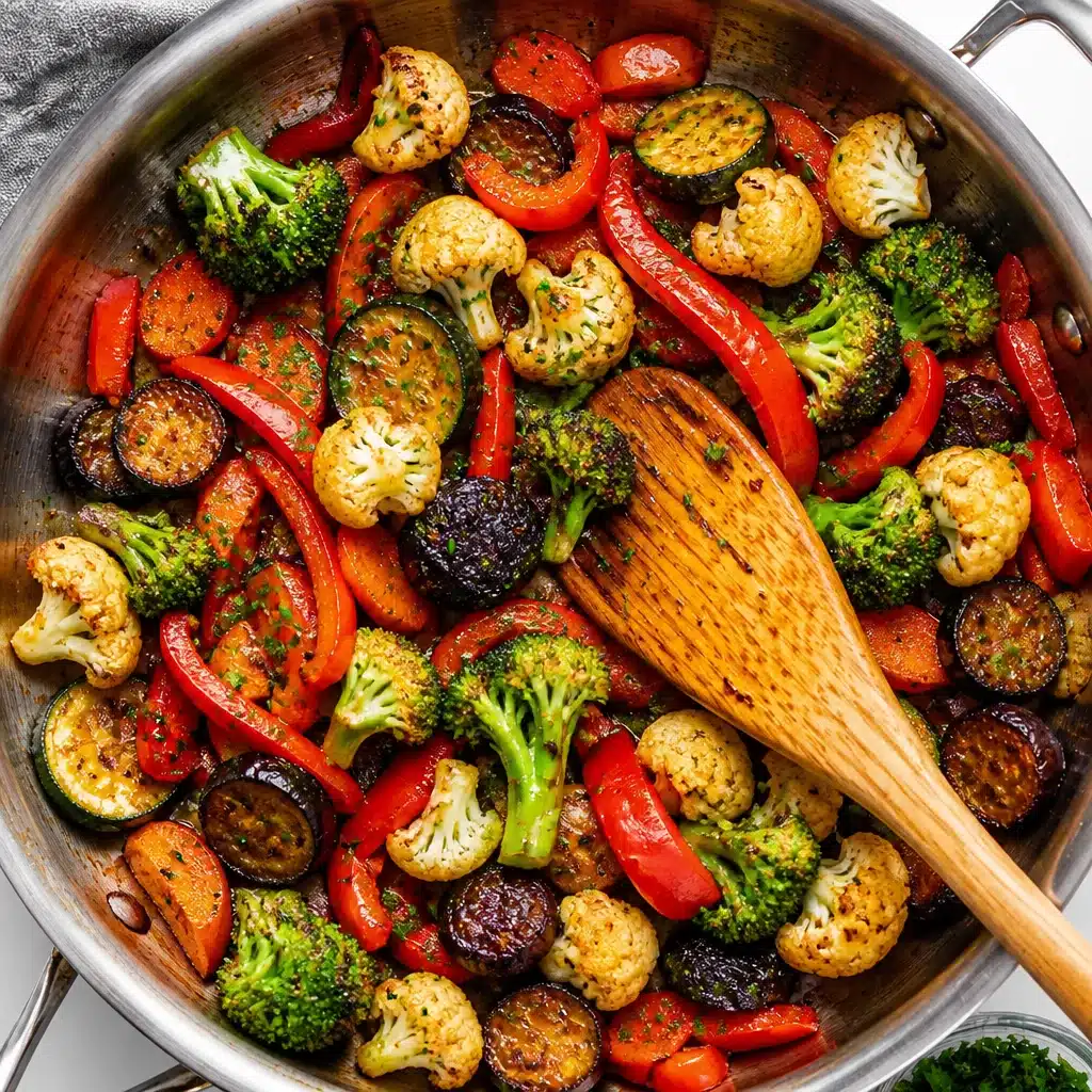 Colorful sautéed vegetables including bell peppers, broccoli, and carrots in a pan.