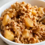 Delicious Apple Crumble with tender cinnamon apples and golden crumbly topping.