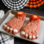Halloween Feet Loaf shaped like a severed foot with onion toenails and ketchup glaze.